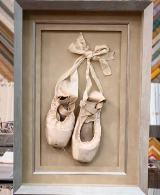 Ballet shoes preserved in a shadow box by Ferrell's Frame & Design