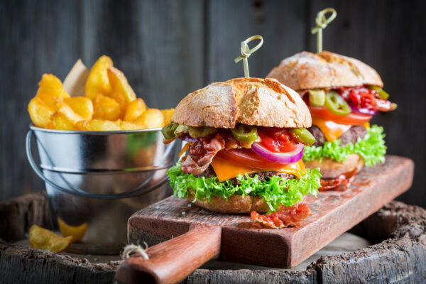 Delicious burger with bacon, tomato and beef